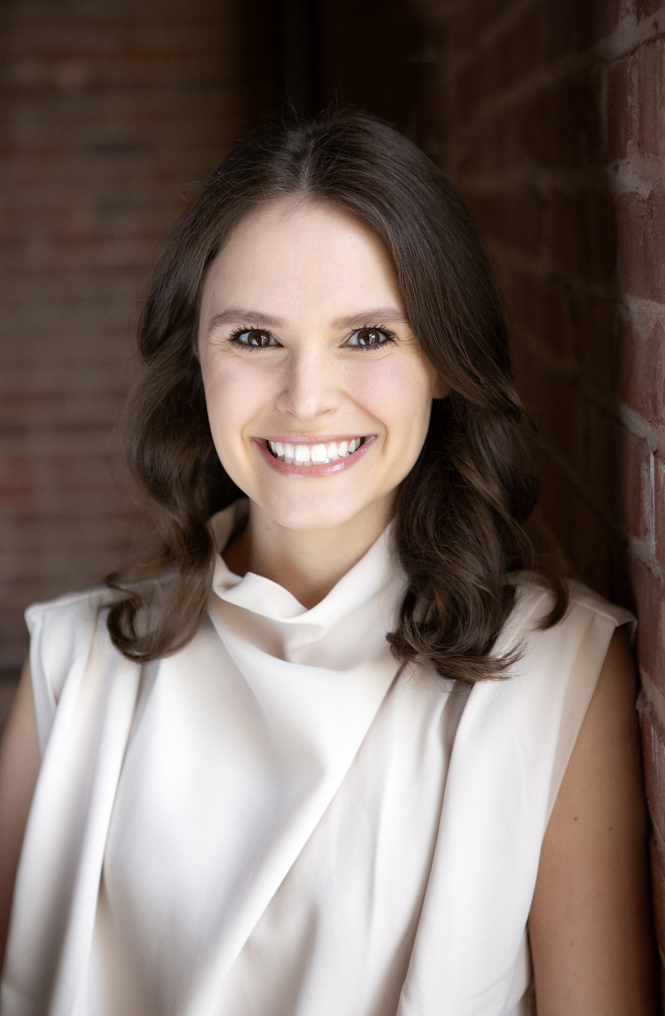 Kaitlyn White, Human Resource Manager at Cognito Forms seen with a bright smile on her face